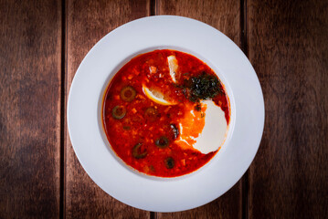 solyanka soup on a wooden background