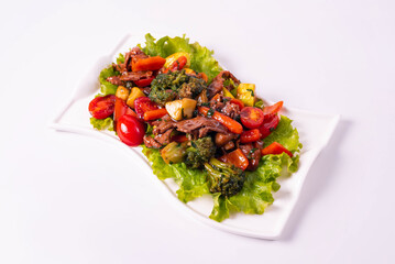 meat with vegetables on a white background