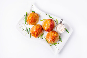 fried manti with sour cream on a white background