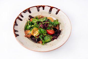 Salad of vegetables and spinach on a white background