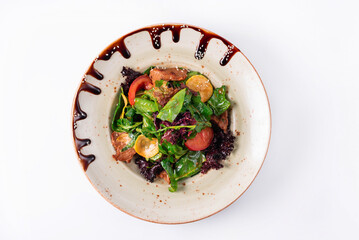 Salad of vegetables and spinach on a white background