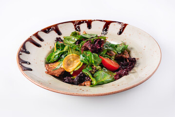 Salad of vegetables and spinach on a white background