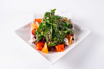 Arugula salad with spinach on a white background