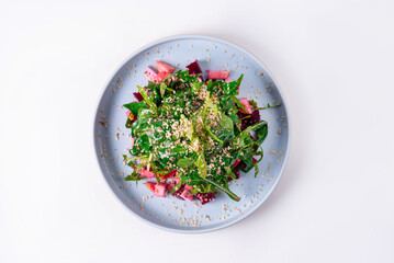 Arugula salad with spinach on a white background