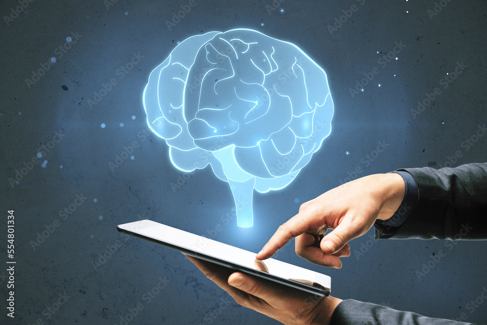 Aufkleber close up of businessman hand pointing at tablet with glowing human brain hologram on blurry wall bac
