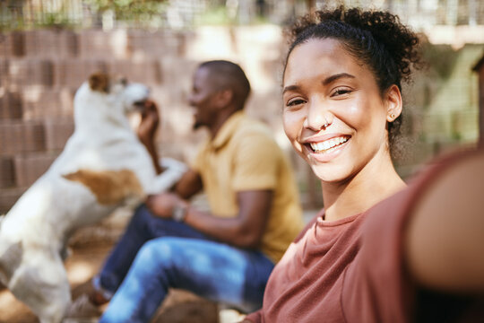 Black woman, selfie and dog adoption with happiness and love with family outdoor. Puppy, pet and woman portrait in the sunshine happy about bringing animal to its new home in summer with a smile