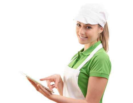 Female sales clerk with tablet at supermarket