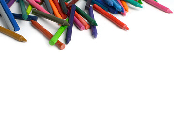 Crayons lined up isolated on white background.