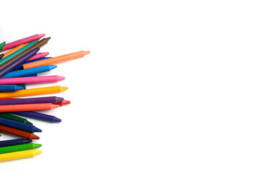 Crayons lined up isolated on white background.