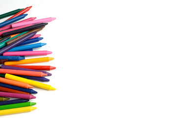 Fototapeta premium Crayons lined up isolated on white background.
