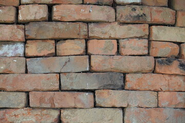 The old used red bricks are laid in an even layer for further operation.