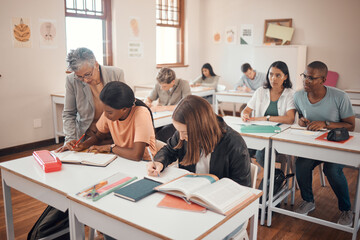 School, students and classroom with teacher help, answer and explain during lesson with young group. Education, study and elderly woman teaching, checking and showing and helping pupil textbook exam