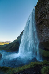 Seljalandsfoss waterfall landmark landscape photo. Beautiful nature scenery photography with valley on background. Idyllic scene. High quality picture for wallpaper, travel blog, magazine, article