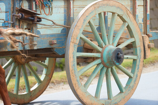 Malagasy wooden chariot, detail of blue-green spoke wheels. Traveling around Madagascar.