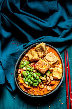Bowl of ready to eat vegan curry with edamame and tofu