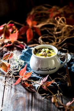 Jug of leek soup with minced meat and cheese
