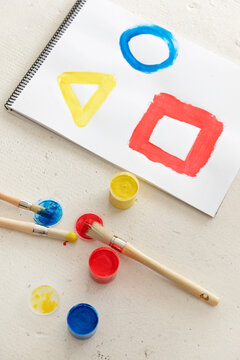Colorful geometric shapes painted in note pad
