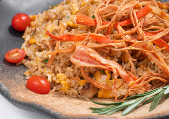 Stir-fried rice with fried crab sticks.