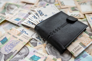 wallet or purse with new 500 1000 ukrainian hryvnia money. Currency, financial concept