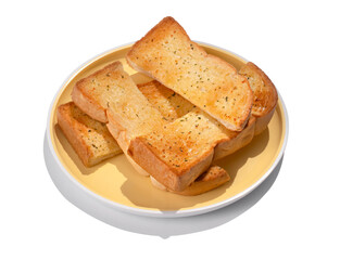 Fresh baked sliced garlic bread on a plate isolated on white background.