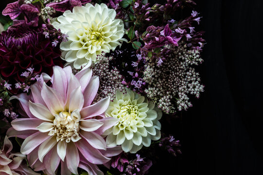 Bouquet of three varieties of dahlias mixed with other flowers