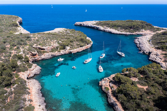 Spain, Balearic Islands, Majorca, Aerial view of Cala Sa Nau bay in summer
