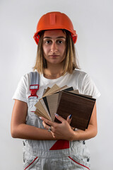 beautiful young woman architect builder in uniform isolated on white background.