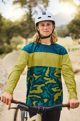 Mountain bike, portrait and man in nature or park for outdoor training, sports competition or fitness goals in Canada with youth lifestyle. Athlete cycling with bicycle and safety helmet for exercise