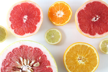 Background made with citrus slices (lemon, tangerine, orange, pomelo and, grapefruit). Citrus...