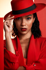 Face, fashion and black woman in red hat, suit and stylish clothing. Portrait, beauty and aesthetic...