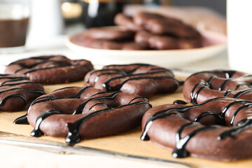 Concept of tasty bakery, gingerbread cookies in chocolate, close up