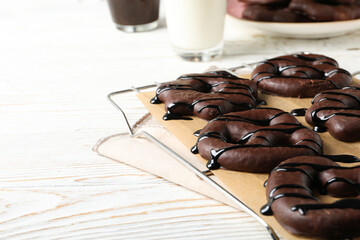 Concept of tasty bakery, gingerbread cookies in chocolate, space for text