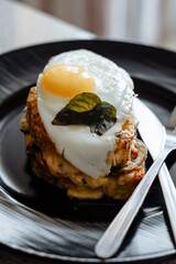 tasty sandwich with cheese, tomatoes and fried eggs
