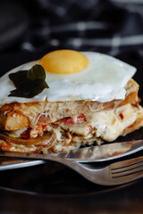 tasty sandwich with cheese, tomatoes and fried eggs