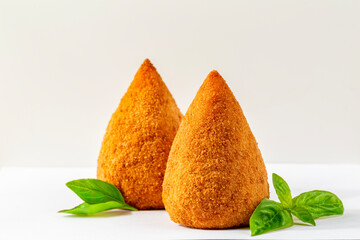  Italian rice balls that are stuffed, coated with breadcrumbs and deep fried.  Filled with ragù,...