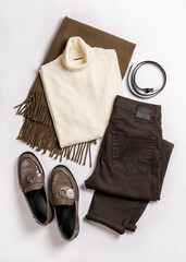 Women's winter or cold weather comfortable clothes set on a white background. Brown jeans or pants,...