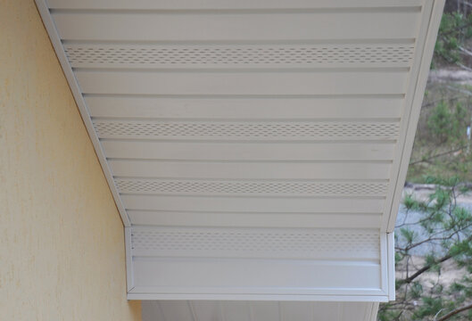  Plastic white uPVC soffit board below the facia of the roof.