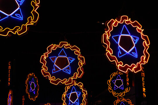Neon lights shaped into traditional parol, a Filipino ornamental lantern displayed during the Christmas season