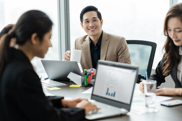 image of a group of Asian businessmen working together at the company