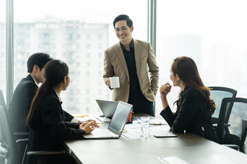 image of a group of Asian businessmen working together at the company