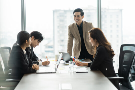 image of a group of Asian businessmen working together at the company