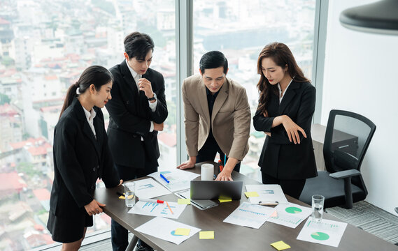 image of a group of Asian businessmen working together at the company