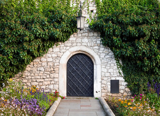 Fairytale door gates around plants and flowers