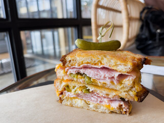 Grilled sandwich with dijon mustard, smoked ham, pickled jalapeños, cheese and mayo. Gourmet fast food concept