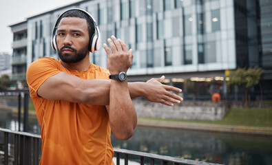 Fitness, black man stretching and headphones, runner in city with music for motivation and exercise...