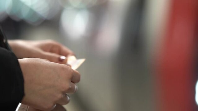 Woman with Metro Ticket in the hand metro station underground train ticket woman hands