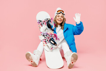 Snowboarder happy woman wear blue suit goggles mask hat ski padded jacket sitting waving hand say...