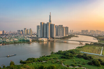 Obraz premium PANORAMA WITH SAI GON RIVER AND BA SON BRIDGE. VIEW FROM DISTRICT 1 TO THU THIEM, HO CHI MINH CITY, VIETNAM