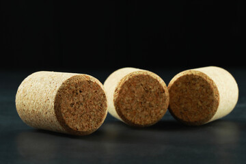 Corks of wine bottles on grey table, closeup