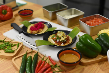 Many ingredients for preparing Tacos in a mexican restaurant 